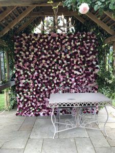 red flower wall hire