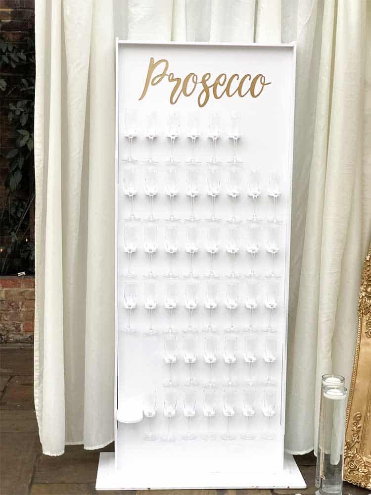 White and gold prosecco wall